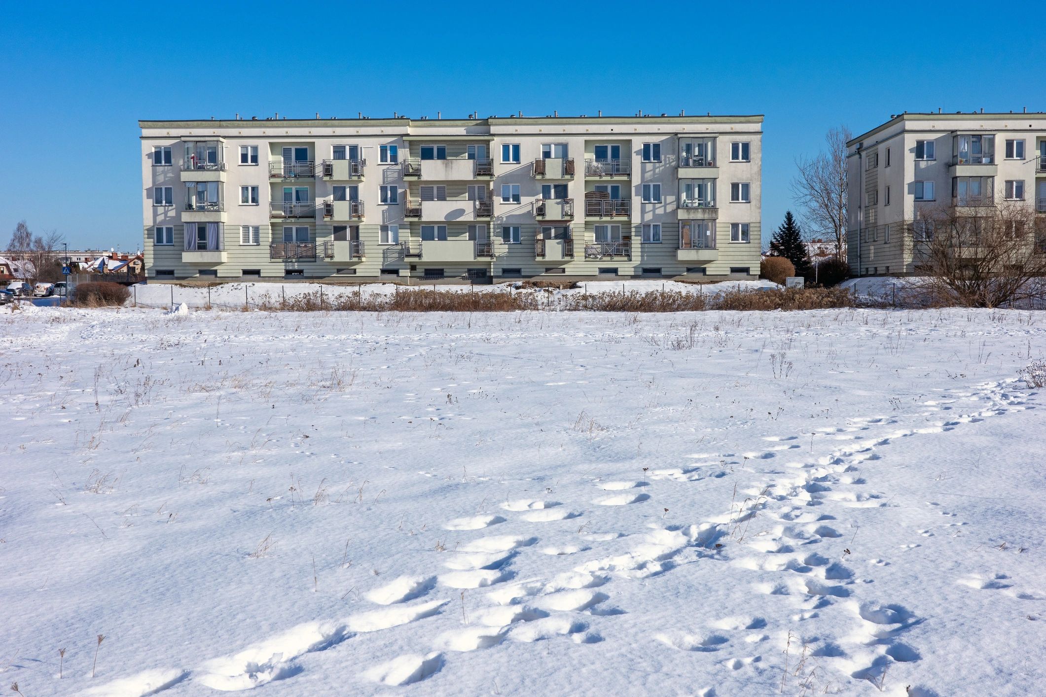 Modern multi-family residential building exterior representing HOA community maintenance
